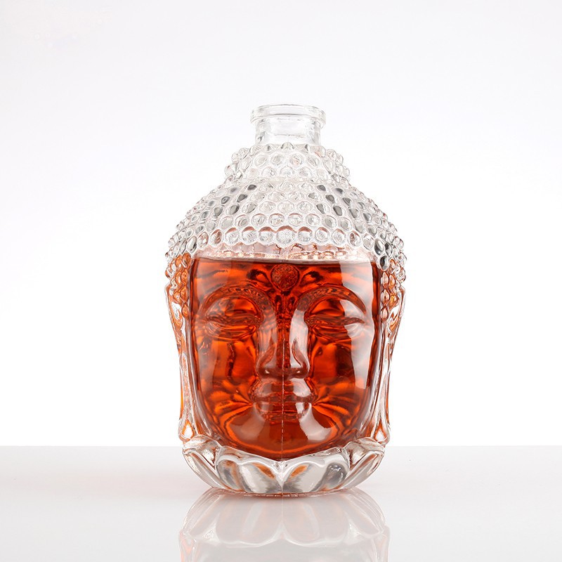 Unique Buddha Face Glass Bottle suppliers