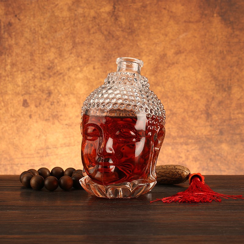 Unique Buddha Face Glass Bottle manufacturers
