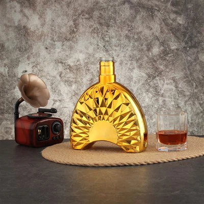 Golden Geometric Patterned Transparent Glass Bottle
